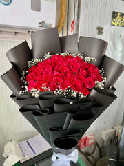 Red Roses in Black Wrap